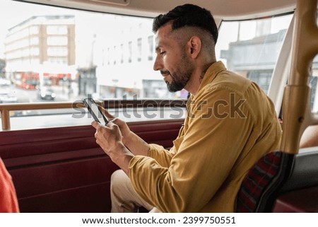 man looking for a partner on a dating app while traveling on the bus
