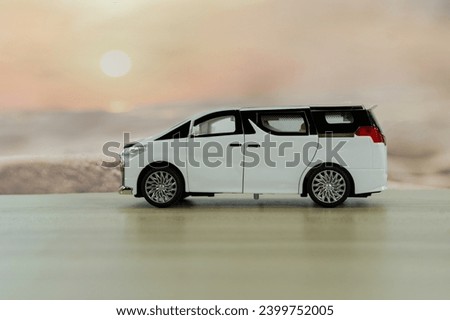 Travel toy  van on the beach background travel concept. Royalty-Free Stock Photo #2399752005