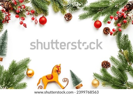 Merry Christmas and Happy New Year background with fir tree branches and decoration.
