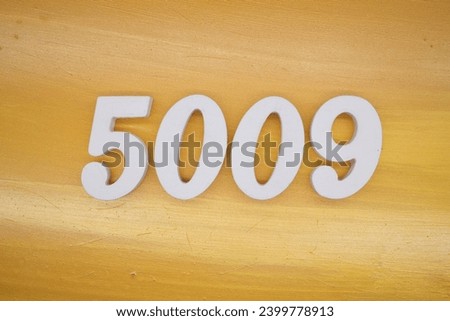The golden yellow painted wood panel for the background, number 5009, is made from white painted wood.
