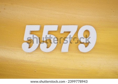 The golden yellow painted wood panel for the background, number 5579, is made from white painted wood.