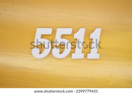 The golden yellow painted wood panel for the background, number 5511, is made from white painted wood.
