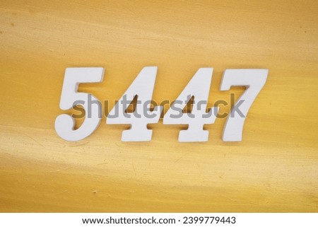 The golden yellow painted wood panel for the background, number 5447, is made from white painted wood.