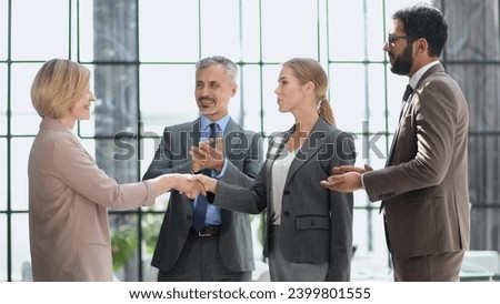 Businessman shaking hands to seal a deal with his partne