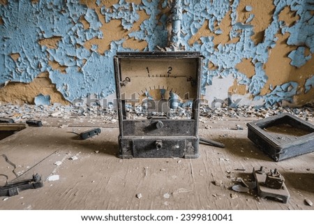 Old measuring instrument in school in Illinci abandoned village in Chernobyl Exclusion Zone Royalty-Free Stock Photo #2399810041