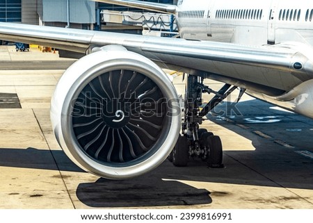 Beautiful picture of a wide-body commercial aircraft wing with its turbine, of the airline parked at John F. Kennedy International Airport, from where it will start its new course.