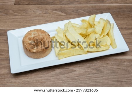 Chip Shop Food, deep fried food, battered food, fish and chips, black pudding, white pudding, burgers and chips, pies, chips, fish chips and peas Royalty-Free Stock Photo #2399821635