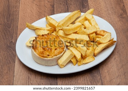 Chip Shop Food, deep fried food, battered food, fish and chips, black pudding, white pudding, burgers and chips, pies, chips, fish chips and peas Royalty-Free Stock Photo #2399821657