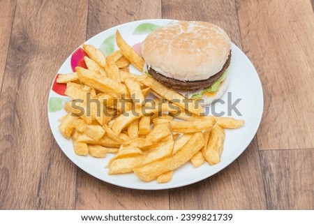 Chip Shop Food, deep fried food, battered food, fish and chips, black pudding, white pudding, burgers and chips, pies, chips, fish chips and peas Royalty-Free Stock Photo #2399821739