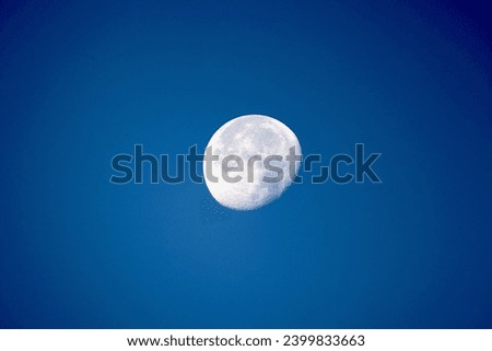Picture of the moon with a blue background