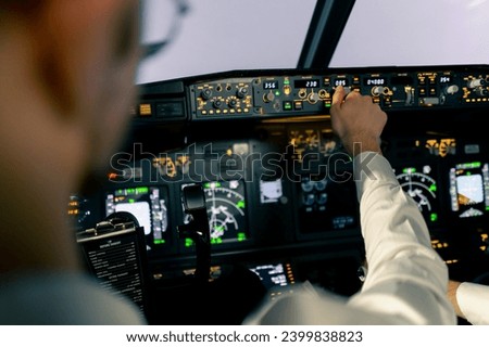 Close-up of an airplane cockpit Center panel with main flight display navigation display Airplane pilot panels Royalty-Free Stock Photo #2399838823