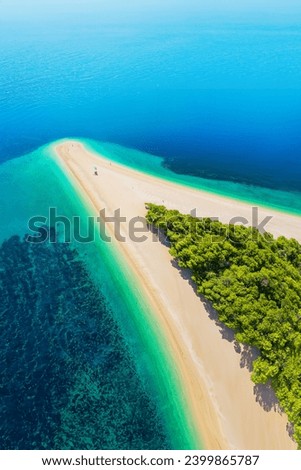 Aerial view of the Golden Horn Beach in Croatia. Also known as Zlatni Rat Beach it was named as one of the best beaches in the world coming in at 12th on the list. Royalty-Free Stock Photo #2399865787