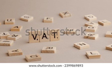 Word VAT written on wooden cubes  Royalty-Free Stock Photo #2399869893