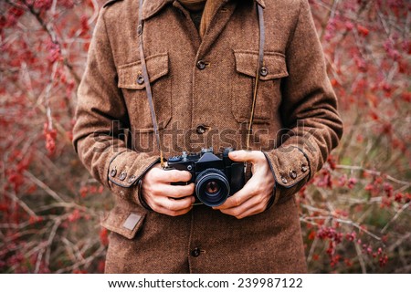 hand holding retro camera close-up