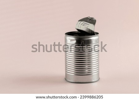 Empty Food Can Opened on Pink Background, Copy Space for Text Royalty-Free Stock Photo #2399886205