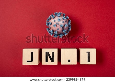 coronavirus and JN.1 variant on a red background Royalty-Free Stock Photo #2399894879