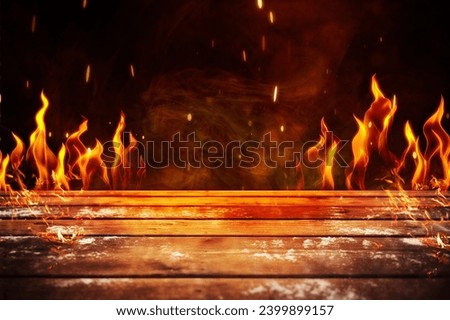 wooden table with burning Fire sparks