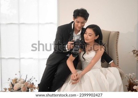 Groom taking pictures of beautiful bride for wedding ceremony, Love ,Romantic and wedding proposal concept.