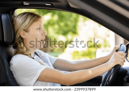 frightened female driver in car