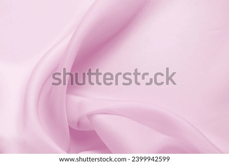 Texture chiffon fabric in purple, lilac,  violet color for backgrounds. silk fabric. selective focus Royalty-Free Stock Photo #2399942599