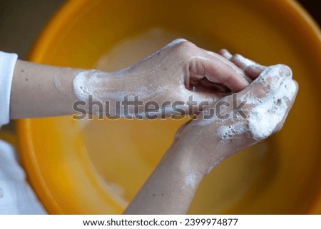 Washing hands. Rubbing with a soap. Close-up. Hand hygiene to reduce the spread of infections. Handwashing to stop spreading coronavirus and other infections.