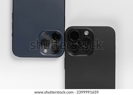 two smartphones on a white background 
iphone 15 pro max black  Royalty-Free Stock Photo #2399991659