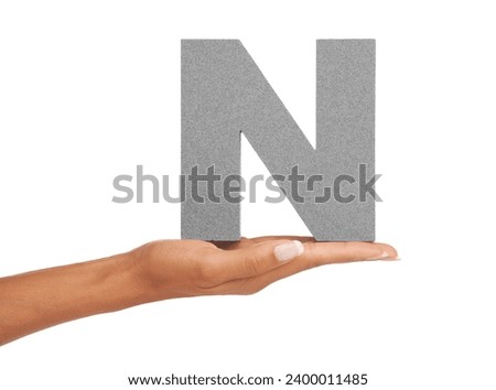 Woman, hand and letter N or alphabet in studio for advertising, learning or teaching presentation. Sign, font or character for abc, text and communication or grammar and symbol on white background