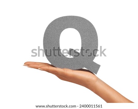 Woman, hand and letter Q or font in studio for advertising, learning or teaching presentation. Sign, alphabet or character for marketing, text or communication and grammar symbol on white background