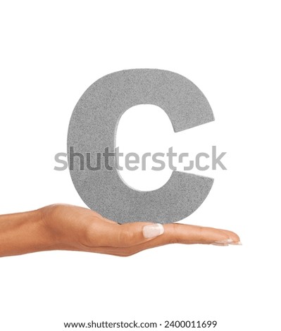 Woman, hand and letter or font in studio for advertising, learning or teaching presentation. Sign, alphabet or character for marketing, text or communication and grammar or symbol on white background