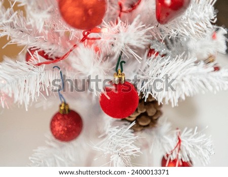 White Christmas tree with red decorations