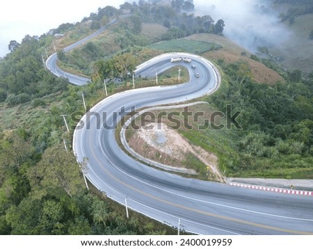 Top view Aerial photo from flying drone over Mountains and winding mountain paths exciting steep at Phu Kao Ngom,Thailand:Use for website banner background,backdrop
