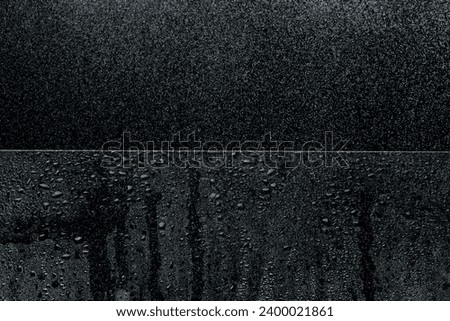 Spray of water or raindrop as fog on mirror as waterdrop. Liquid drop as cold cool on surface in bubble form. The weather purity make windows has water drop dew. Black background isolated Royalty-Free Stock Photo #2400021861