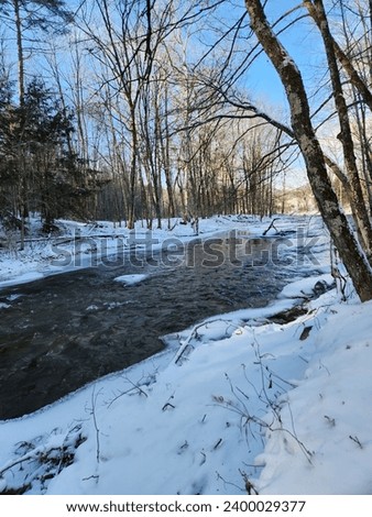 Down by the icy river Royalty-Free Stock Photo #2400029377