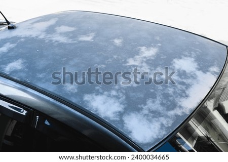 Damage and oxidation clear coat on the car roof ,car paint oxidation and faded paint. Royalty-Free Stock Photo #2400034665