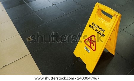 over head view of caution wet floor sign