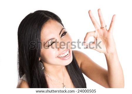 An isolated shot of a beautiful asian woman with an OK sign