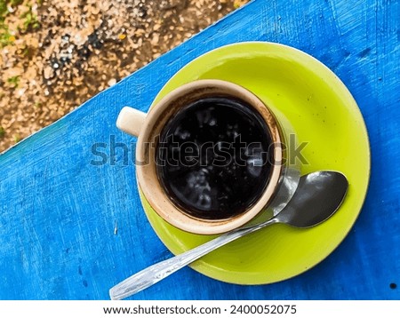 black coffee during the day outdoors

