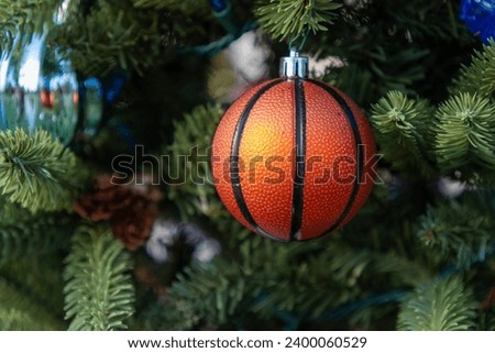 Basketball ornament hanging from Christmas tree