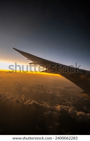 Sunrise over the Clouds from an Airplane
