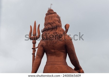 back view of hindu god lord shiva isolated statue with bright background at morning image is taken at statue of belief nathdwara rajasthan india.