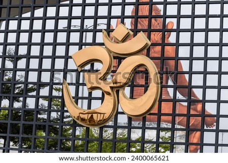 hindu holy religious symbol AUM or OM from unique perceptive at morning symbolizes the Universe and the ultimate reality image is taken at statue of belief nathdwara rajasthan india.