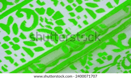 Silk cloth, green cloth. Shades of delicate exquisite flowers on a white background, photo of Paisley print. Texture, pattern, collection