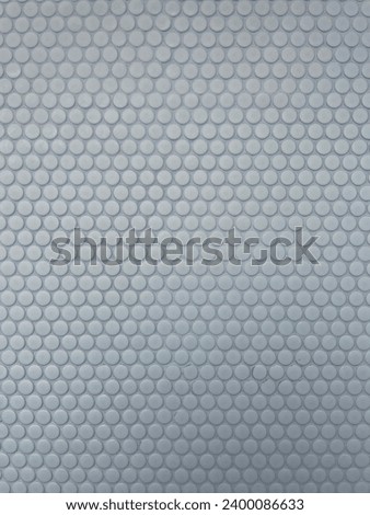 interior photo view of a geometrical geometric repetitive pattern forming a full screen wallpaper background with textured material