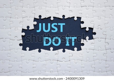 Just do it symbol. Concept words Just do it on white puzzle. Beautiful deep blue background. Business and Just do it concept. Copy space.