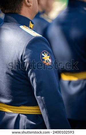 Military pilots at the parade, officers. Russian Air Force Day. Royalty-Free Stock Photo #2400102593