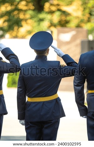 Military pilots at the parade, officers. Russian Air Force Day. Royalty-Free Stock Photo #2400102595
