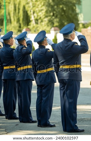 Military pilots at the parade, officers. Russian Air Force Day. Royalty-Free Stock Photo #2400102597