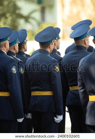 Military pilots at the parade, officers. Russian Air Force Day. Royalty-Free Stock Photo #2400102601
