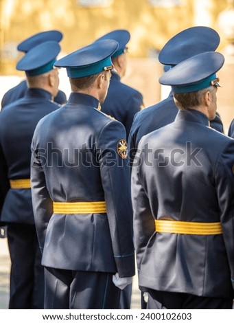 Military pilots at the parade, officers. Russian Air Force Day. Royalty-Free Stock Photo #2400102603