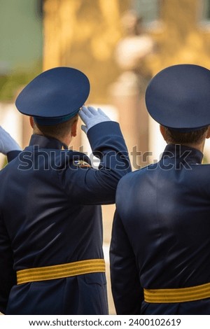 Military pilots at the parade, officers. Russian Air Force Day. Royalty-Free Stock Photo #2400102619